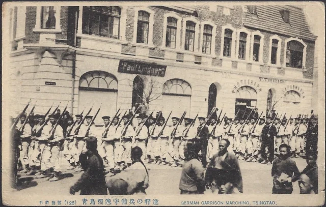 German naval soldiers marching in front of the Takahashi studio building.